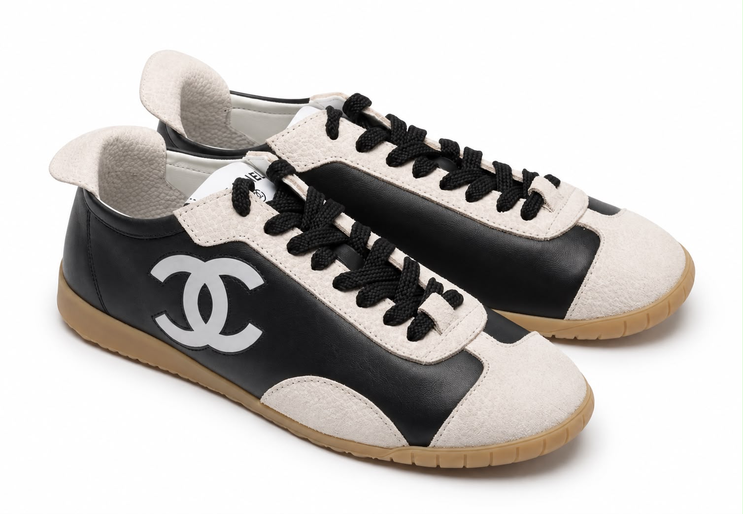 CHANEL Sneaker in Black Calfskin & White Suede Calfskin